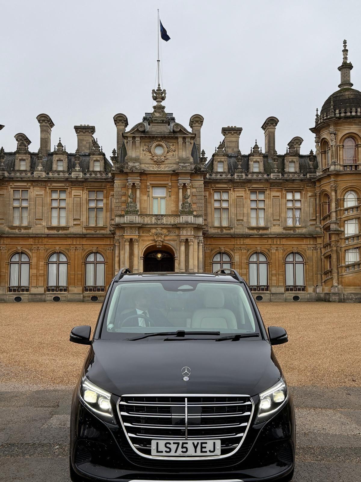 Luxury car at grand entrance